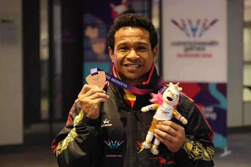 Morea Baru smiling with his Glasgow 2026 bronze medal